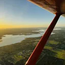 Red Pilot Rise aircraft flying